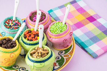 Assorted topping for ice cream.