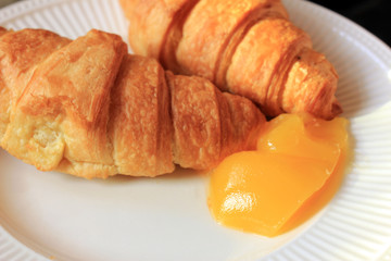 Fresh croissant and lemon curd