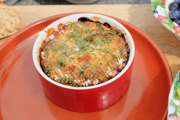 bowl with baked cheese