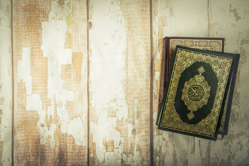 Koran - holy book of Muslims ( public item of all muslims ) on the table , still life .