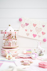 Fairy tales concept in pink and white. Cute macarons of mermaid and unicorn. Top view.