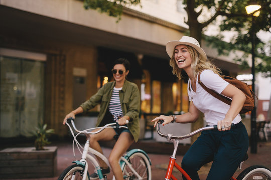 Female friends enjoying bicycle ride