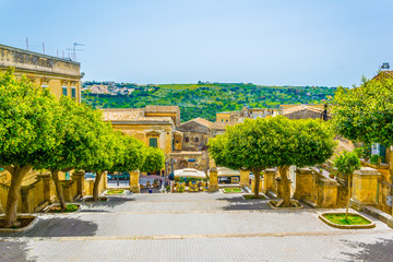 View of a small square in front of the Chiesa di san Giovanni Evangelista in Modica, Sicily, Italy
