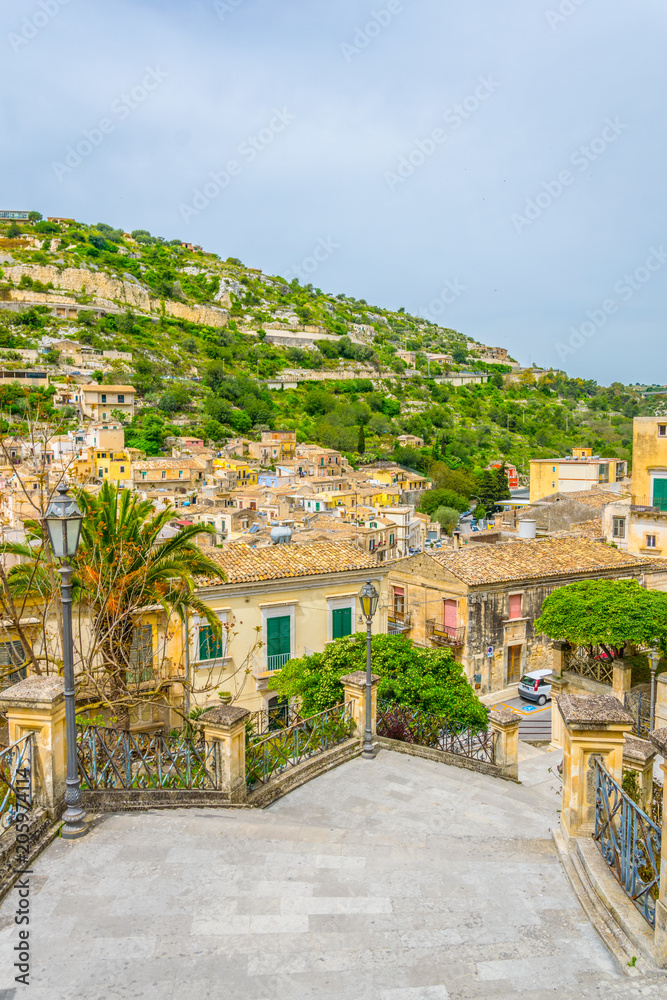 Wall mural view of a stairway in modica in sicily overlooking city beneath it