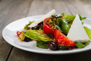 Appetizing gourmet Mediterranean feta and cashew vegetable salad, banquet, restaurant menu, dining concept