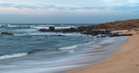 Long exposure of waves breaking on a beach on Molokai, Hawaii