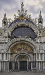 Fototapeta na wymiar Detail of one of the three doors into the Basilica San Marco, Venice