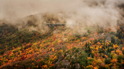 Autumn day on the Blue Ridge Parkway of the Linn Cove Viaduct shrouded in clouds and fog	