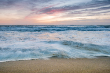 Fototapeta premium Colorful Beach Sunset with Waves