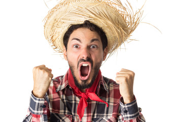 Festa Junina is a brazilian party. Man wearing plaid shirt and straw hat, costume as Caipira.