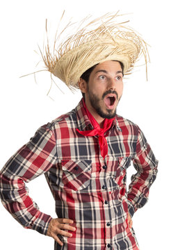 Festa Junina is a brazilian party. Man wearing plaid shirt and straw hat, costume as Caipira.
