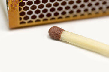single matchstick with a box