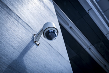 CCTV security camera front of a building in city of China. - obrazy, fototapety, plakaty