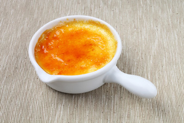 Delicious french dessert creme brulee  on the table