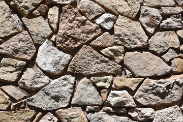 Abstract background of a rough stone wall