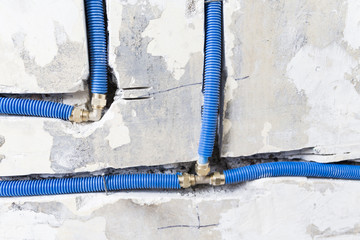 Water pipes made of polypropylene PEX in the wall, plumbing in the house. Installation of sewer...