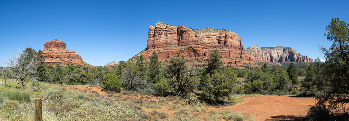 Panorama view of Bell Rock and Courthouse Butte from Red Rock Scenic Byway in Sedona, Arizona