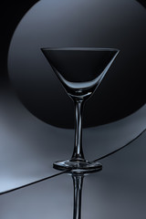 silhouette of empty martini glass on dark background