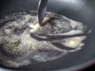 Fototapeta premium Melted Butter On Non Stick Pan