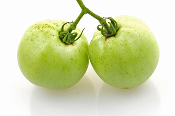 Green tomatoes on a white background