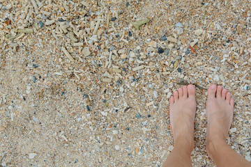 Woman's Bare Feet on the beach.