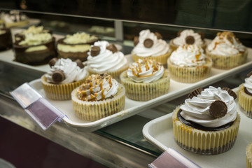 Artisanal cupcakes and cookies at a bakery on display