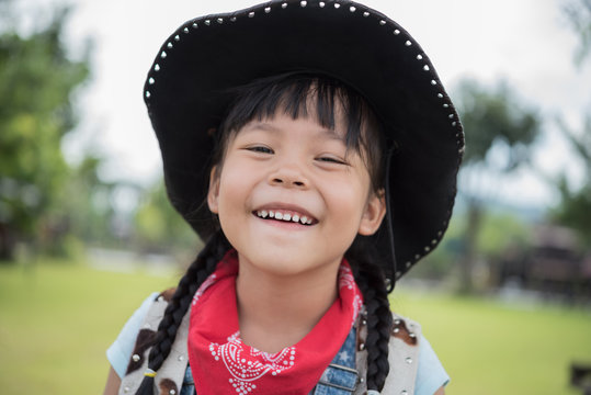 little girl in cowboy outfit