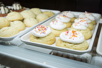 Artisanal cupcakes and cookies at a bakery on display