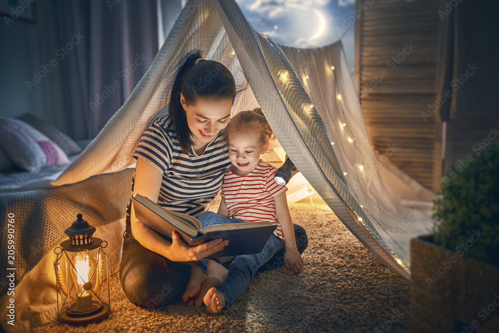 Wall mural Mom and child reading book