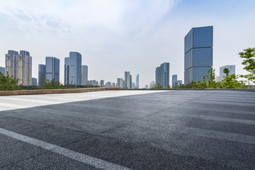 Fototapeta na wymiar Panoramic skyline and buildings with empty road