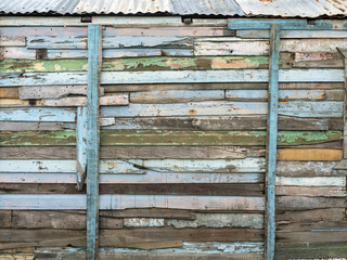 Wall of old multi-colored wooden boards