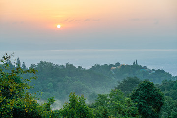 Chiang Mai city and Wat Phra That Doi Suthep covered by fog in morning.