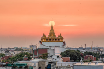 beautiful sunset behind Golden mountain (Wat saket) most famous famous Bangkok Landmark.