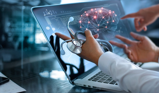 Medicine doctor team meeting and analysis. Diagnose checking brain scan with modern virtual screen interface on laptop with stethoscope in hand, Medical technology network connection concept.