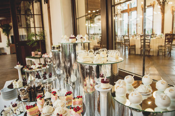 Beautiful candy bar of pink and white sweets decorated with figu