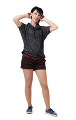 Fototapeta premium young woman posing in studio on white background, wearing brown shorts and shirt