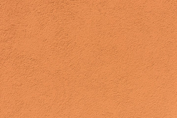 Fototapeta premium close-up view of orange rough weathered background