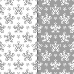 White and gray set of floral backgrounds. Seamless patterns