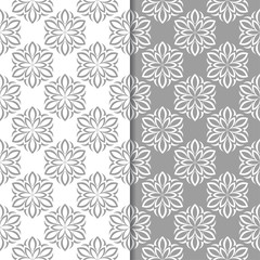 White and gray floral ornaments. Set of seamless backgrounds