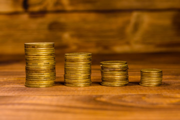 Stack of the coins on wooden table