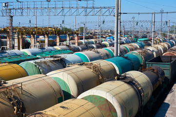 Many freight oil cars at the station.