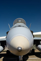 Fototapeta na wymiar Nose of a jet fighter at an air show against a blue sky