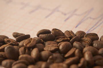 Loose roasted coffee beans on an ECG tracing