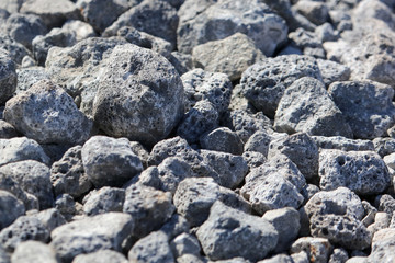 Stone crushed stone on the construction site as an abstract background