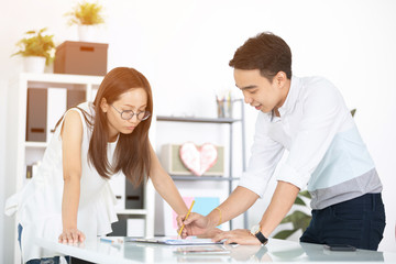 Fototapeta premium Young asian happy executives, employees discussing new project