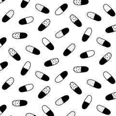 Hand drawn vector illustration of pill capsule medicine pattern in black and white.