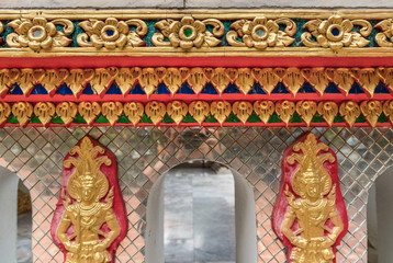 Fototapeta na wymiar detail of beautiful decorative geometric ornaments with gemstones in Buddhist temple