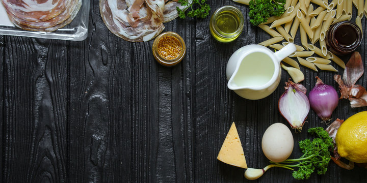 set of ingredients for pasta cooking - penne with cream sauce and pancheta (meal) - cuisine.  Food background