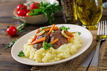 Fried chicken liver with vegetables and garnish of mashed potatoes. Healthy food