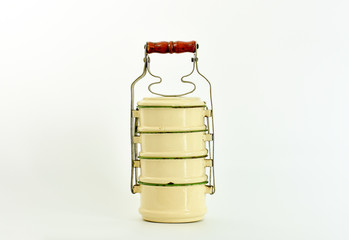 Vintage food container from last century. Enamel metal food carrier for all kinds of food from the old days.